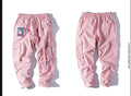 Influx men's Harajuku Hong Kong wind harem pants in black with loose straight-leg cut and waistband