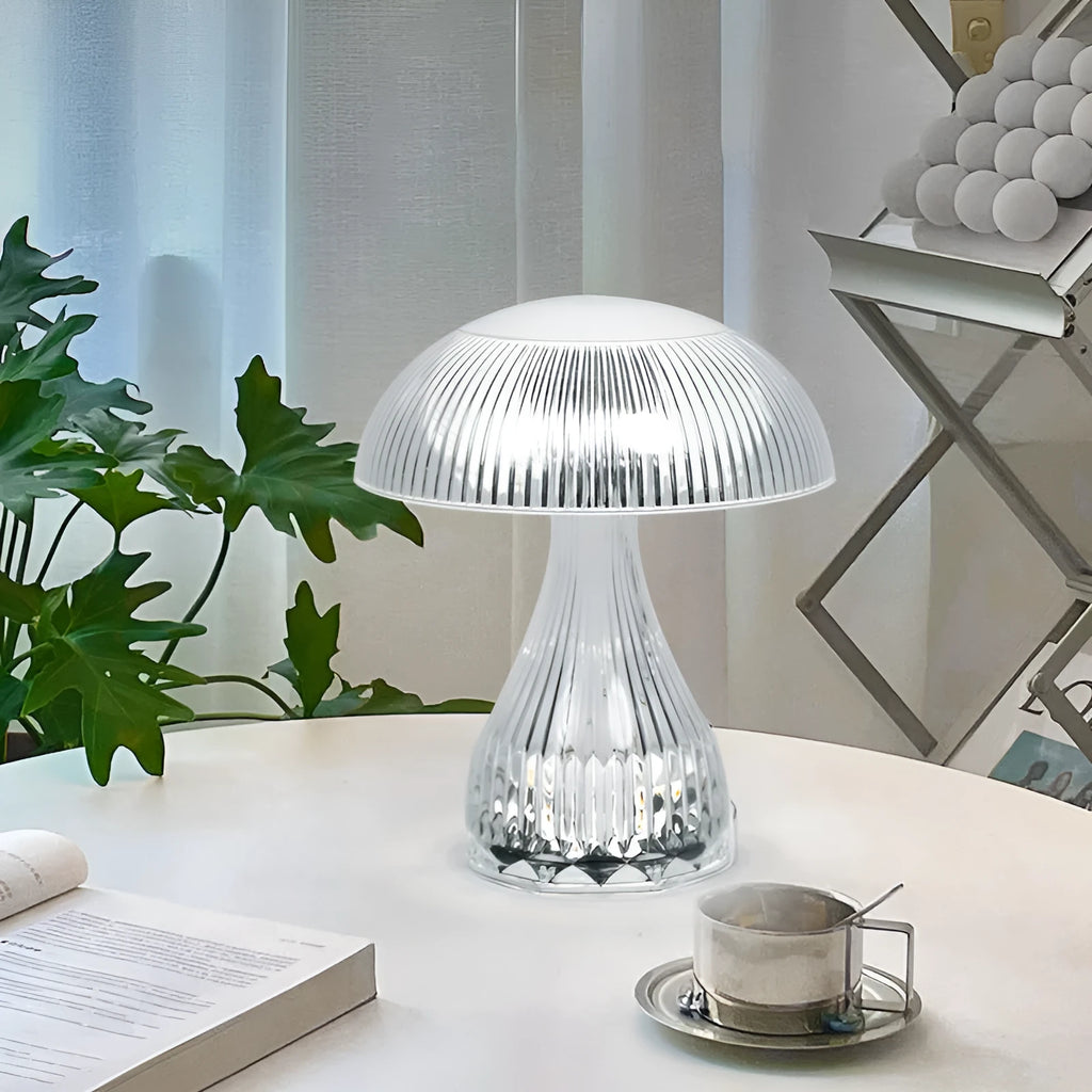 Small white rechargeable night lamp with USB port and colour-changing LED light on a table.