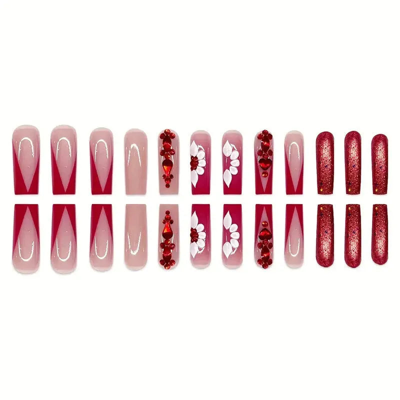 Set of sweet flower pattern press-on artificial nails with prismatic red diamonds in a long European square style.