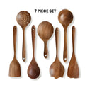Wooden kitchen utensil set with seven pieces including cooking spoons and spatulas in natural wood finish