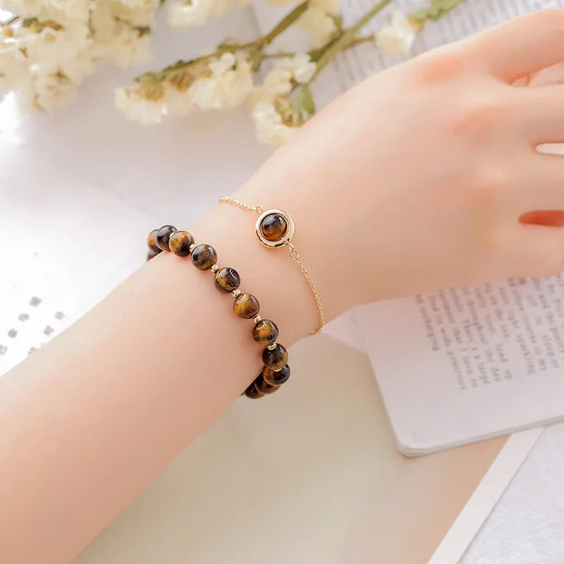 Double-layer women's bracelet with crystal beads and lucky charms in gold electroplated finish