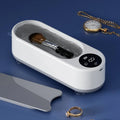 White ultrasonic glasses cleaning machine with display, USB port, and 200g weight