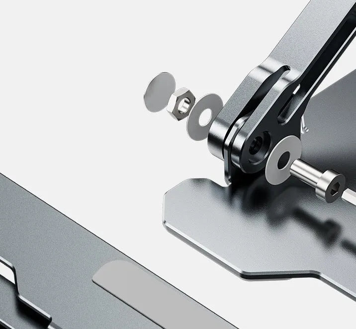 Grey aluminium laptop stand with adjustable angle, folded flat next to a laptop.