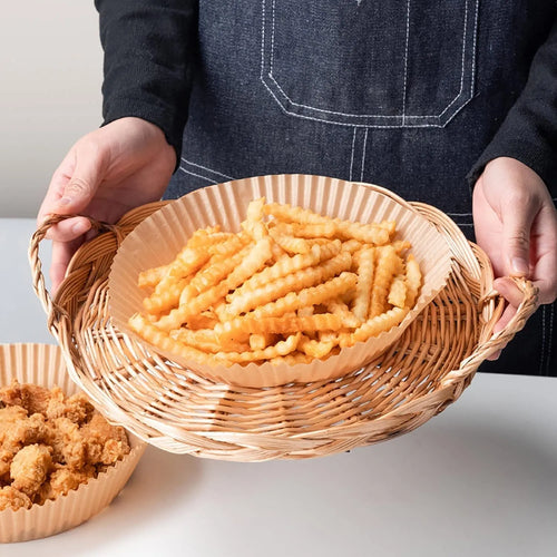 Pack of white round disposable paper liners for air fryer with 4.5cm high edge