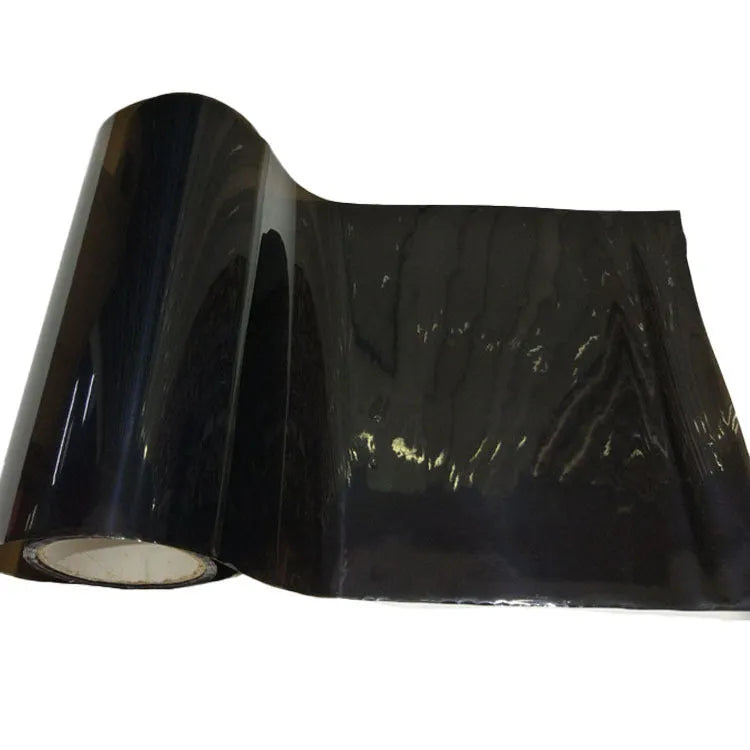 A roll of 30cm wide dark grey car lamp protective film for headlight and taillight protection.