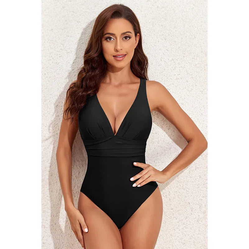 Women's solid colour cross-shoulder one-piece swimsuit in minimalist design