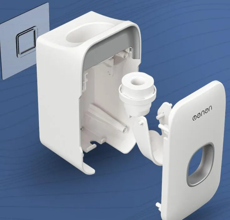 Blue automatic toothpaste dispenser mounted on a bathroom wall with a push-button for one-handed use.