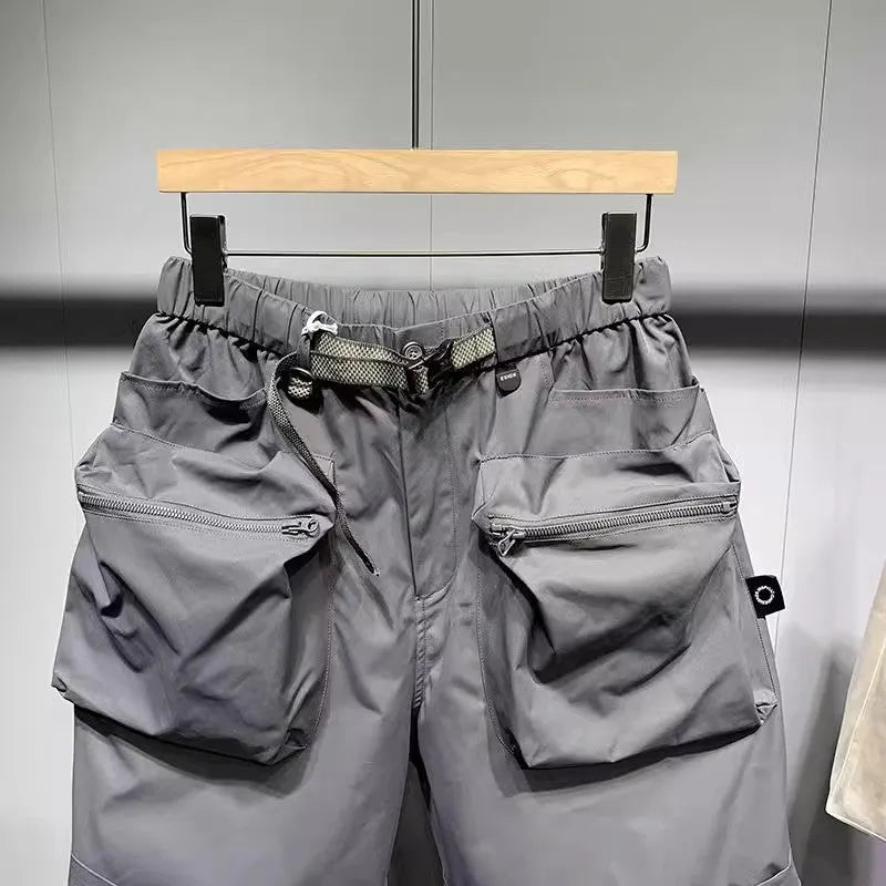 Large size men's work shorts in black with multiple pockets and straight leg design