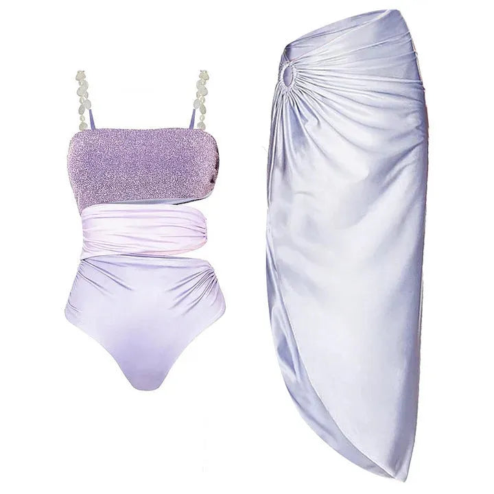 Purple one-piece swimsuit with a matching wrap skirt on a mannequin.