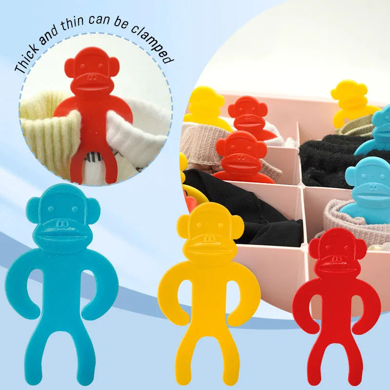Plastic anti-winding socks clips in blue, red and yellow colours for laundry organisation