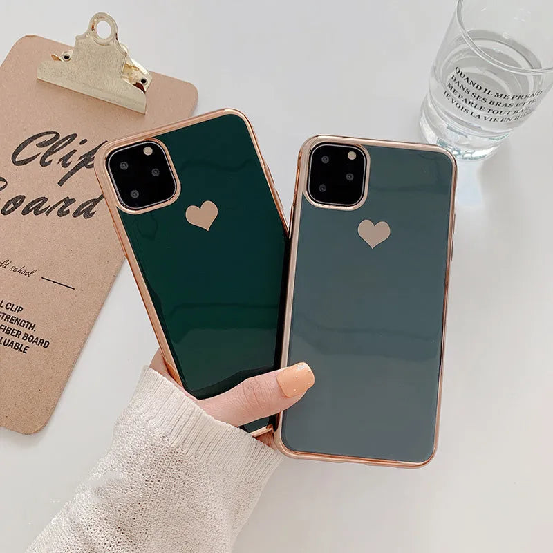 Simple solid-colour TPU back cover case for iPhone on a table, showing blue colour option.