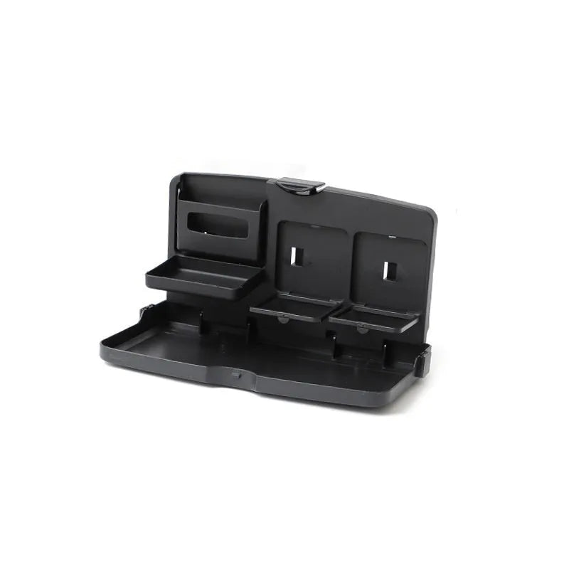 Black foldable car steering wheel laptop stand with a drink cup holder on a table.