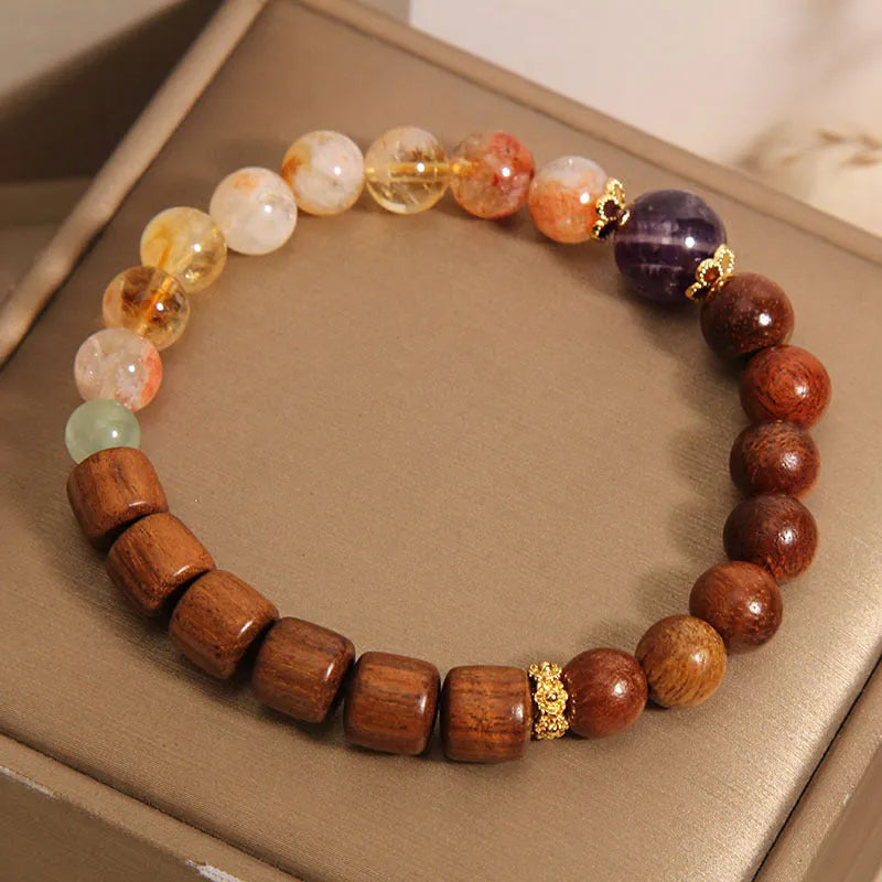 Women's bracelet with yellow tower crystal and amethyst beads, pearl and rhinestone accents