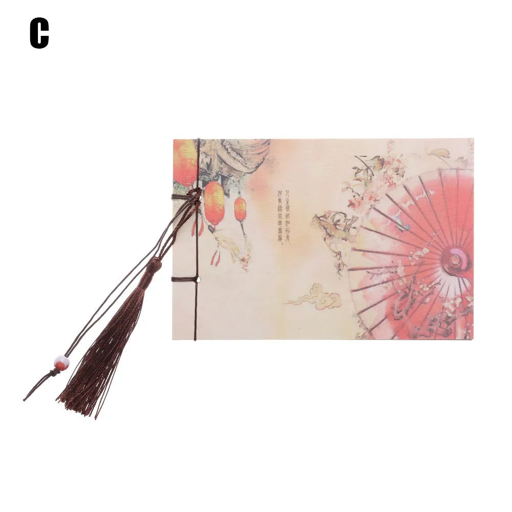 Hand-stitched kraft paper notebook with a tassel bookmark, shown in a natural colour.