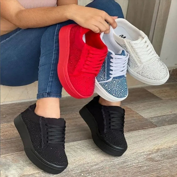 Plus size women's black casual sports shoes with rhinestone detail, flat rubber sole, and lace-up front.