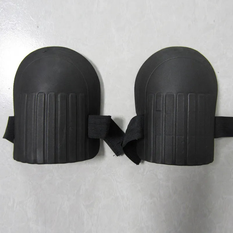 A pair of simple EVA foam knee pads in an army green colour, showing their rectangular shape and thickness.