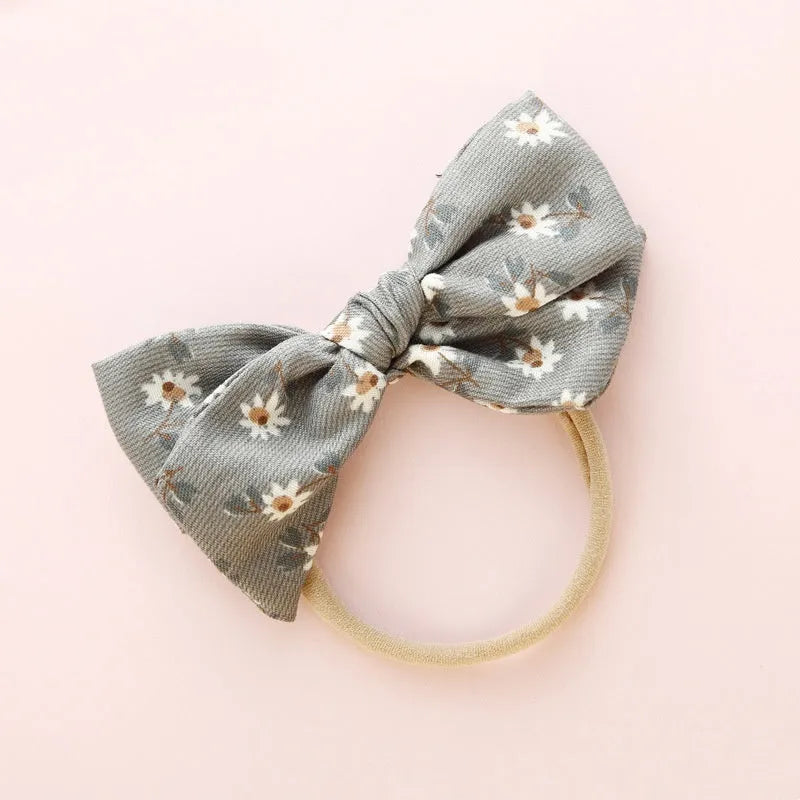 Children's knotted bow hair band in cloth fabric with six colour options