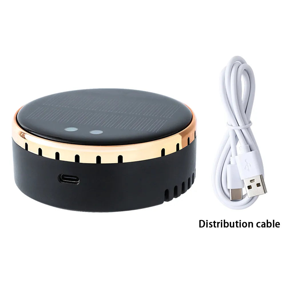 Compact black solar-powered car air humidifier installed in a vehicle air vent.