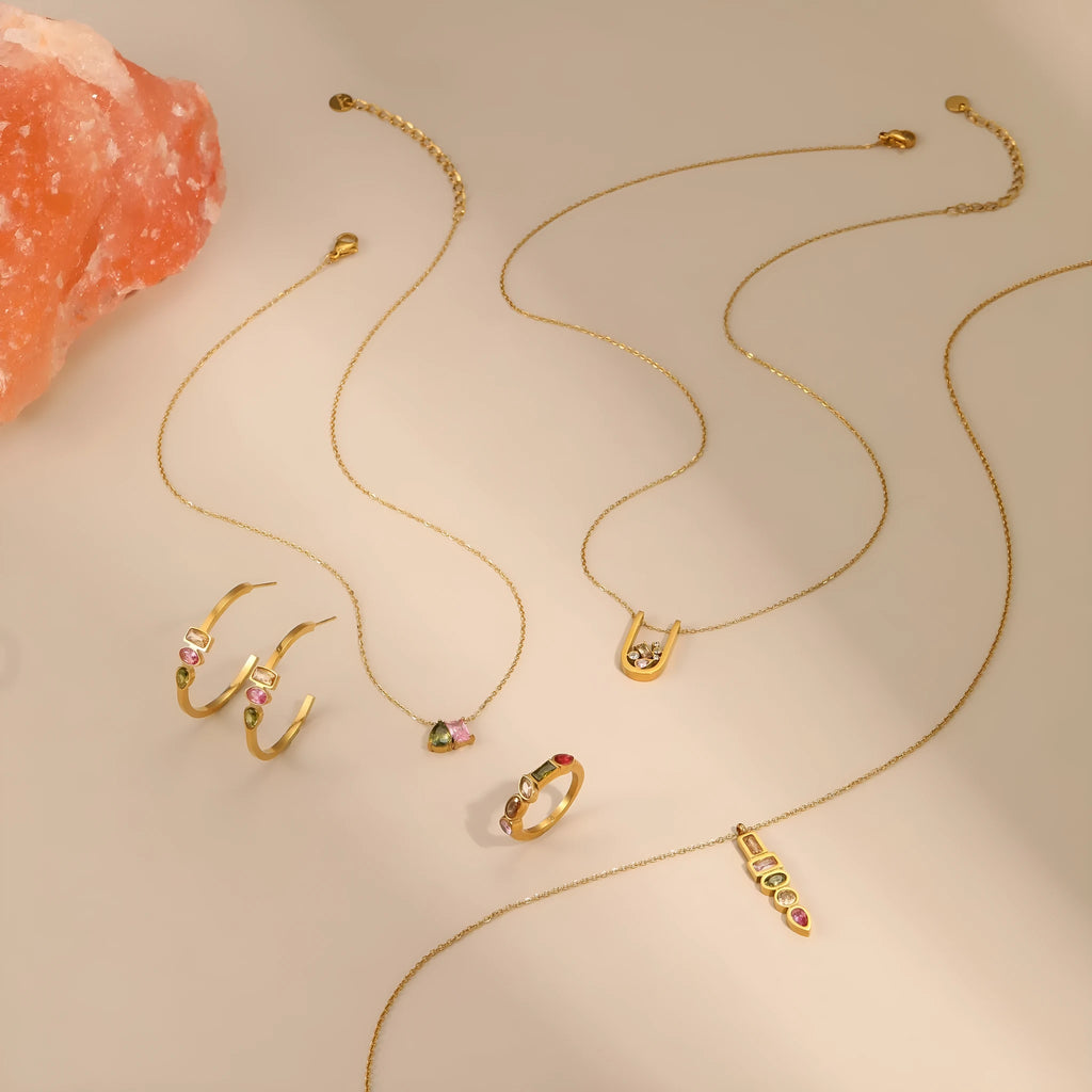 Geometric gold plated jewellery set with necklace, ring, and earrings on stainless steel chain