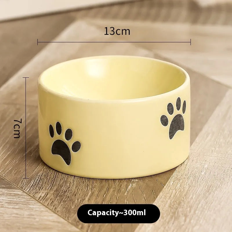 Ceramic cat bowl with high-footed design showing cat's paw decoration pattern in selected colour