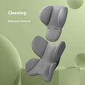 Children's safety seat cushion with waist support and head protection pad in knitted fabric and sponge, shown in assorted colours.