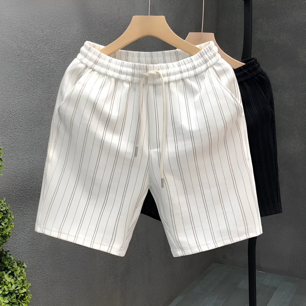 Black and white striped men's casual fleece-lined shorts with an elastic waistband.