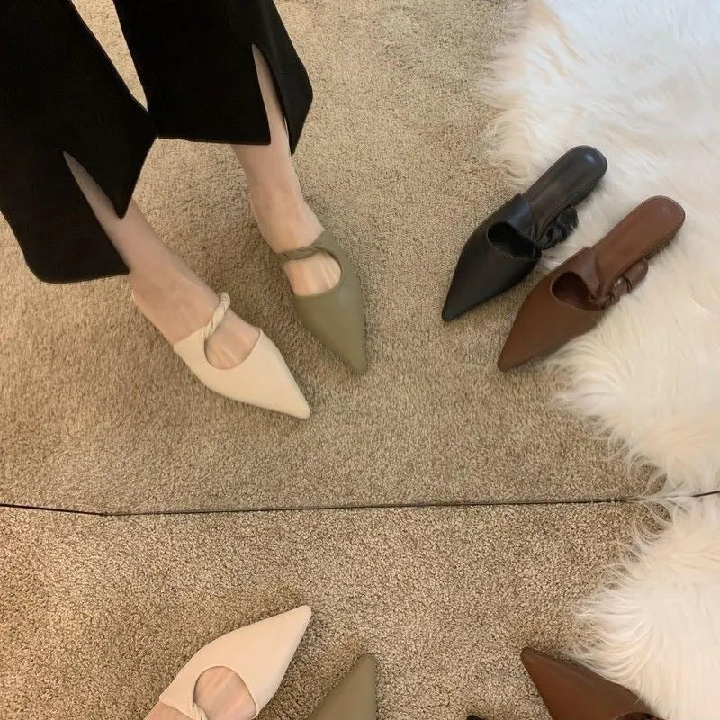 Women's soft leather-lined semi-toe box slippers with a rubber sole in dark brown.