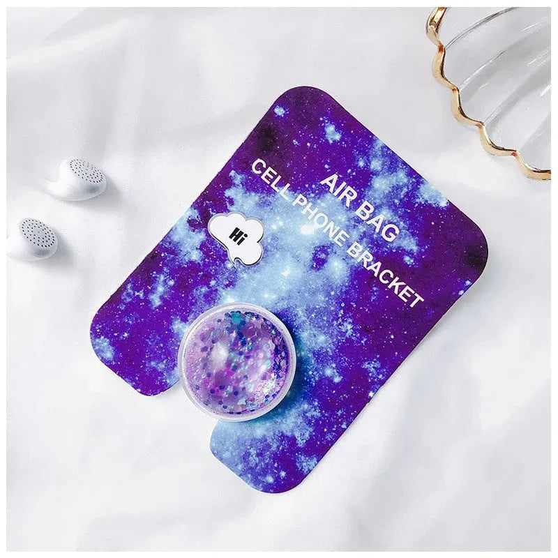 Quicksand phone holder in seven colours with liquid glitter effect, universal stand for desk or bedside use.