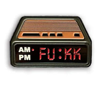 Black metal retro electronic alarm clock brooch pin with original design on a jacket lapel