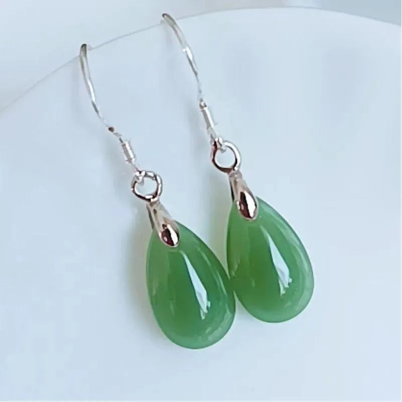 Natural Hetian water drop jade earrings on display showing gray jade colour with alloy ear wire
