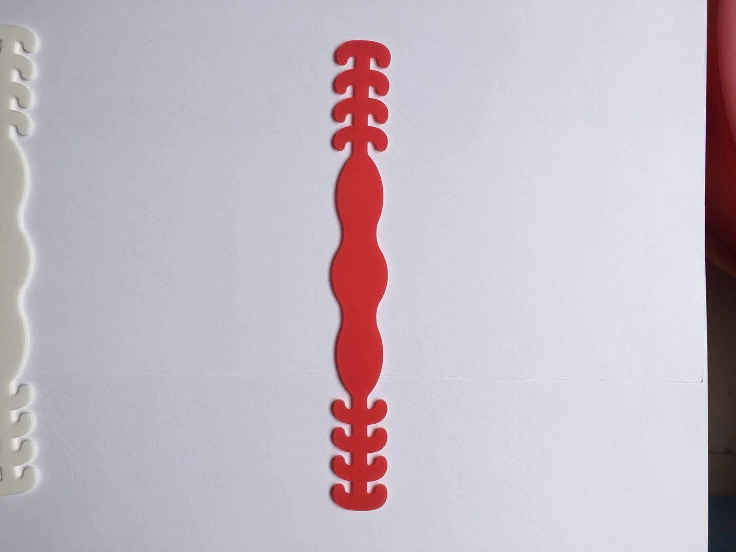 Eight silicone tool buckles in different colours for cable and tool organisation