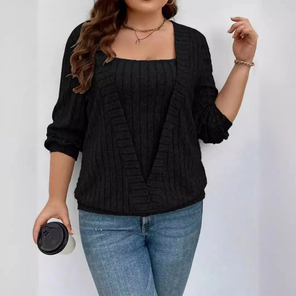 Woman wearing a solid colour purple rib knit V-neck long sleeve false two-piece suit with a loose fit.