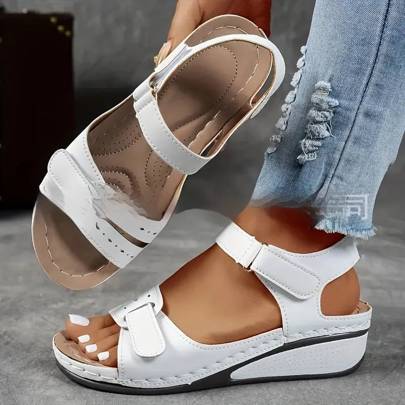 Women's beige plus size strap sandals with thick composite sole and Velcro fastening shown from side.