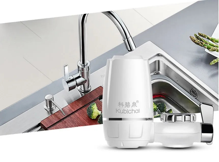 White plastic faucet water filter unit with adapters and ceramic cartridge for kitchen tap installation.