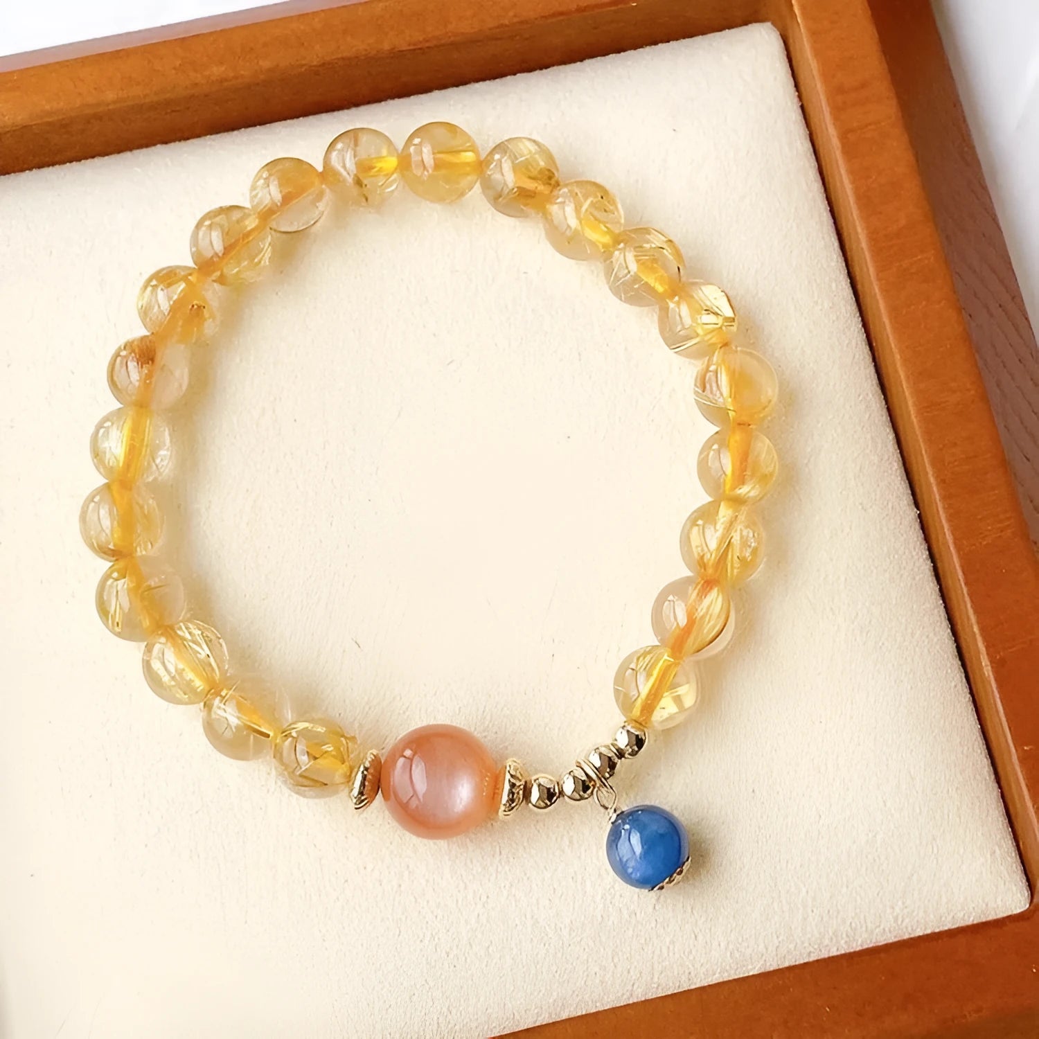 Handmade natural gold rutilated quartz and sunstone crystal bracelet with round diamond-shaped elements