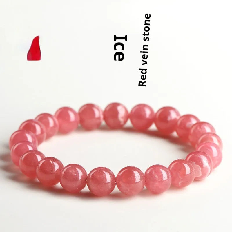 Women's crystal bracelet with a longevity lock clasp and geometric beads in rhodochrosite colours.
