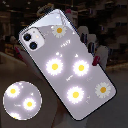 White luminous iPhone case with painted daisy design and voice-activated colour light feature.