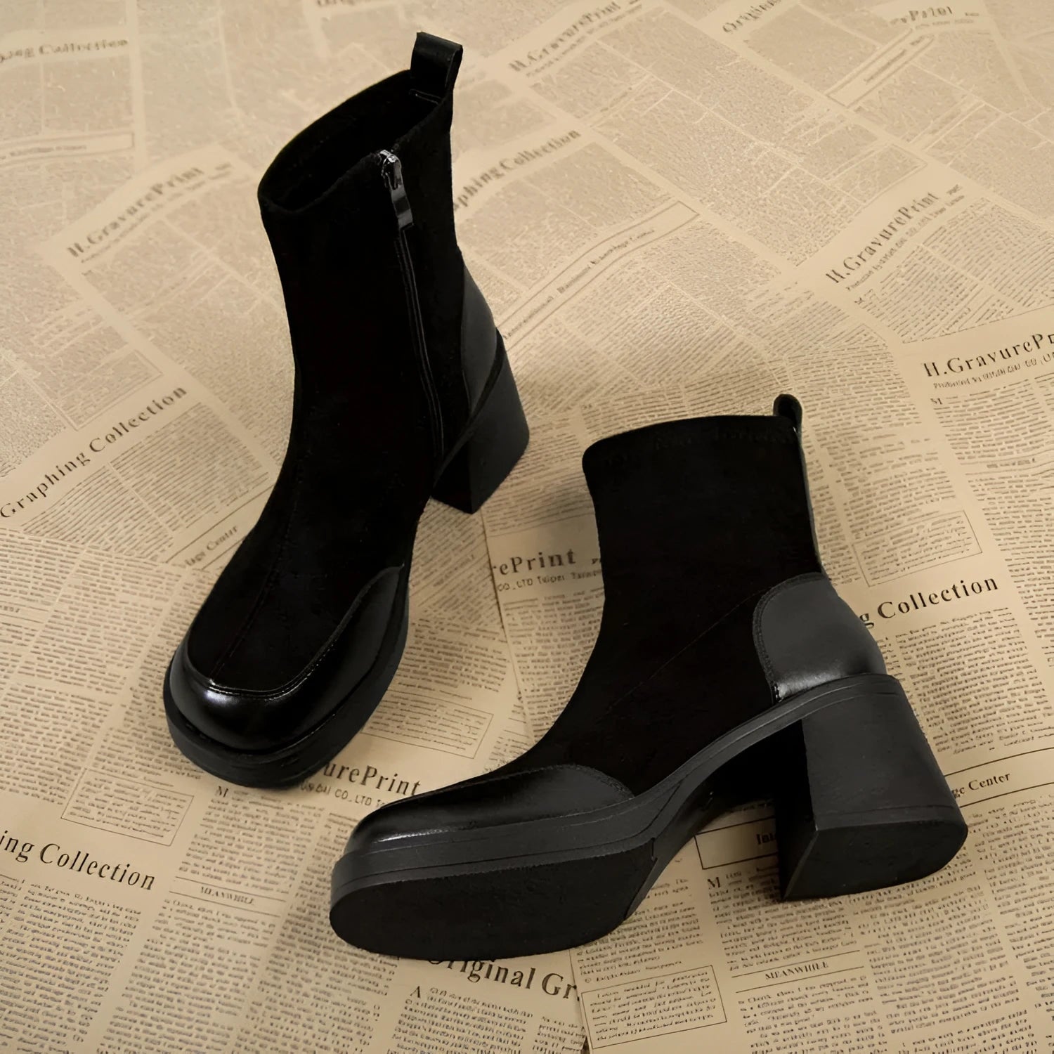 Women's black Martin boots with chunky heel and thick rubber sole, side view