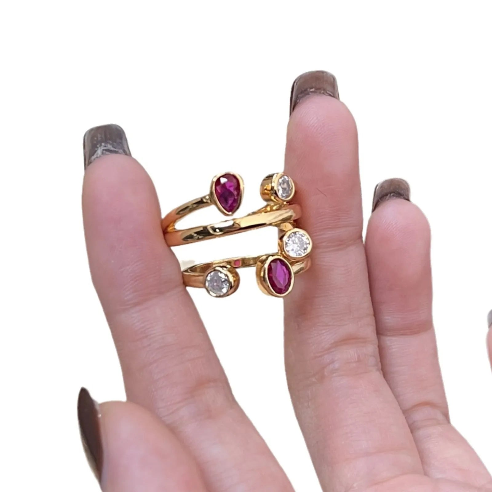 Double-headed copper ring with irregular geometric cross design and group diamonds in two-tone colours.