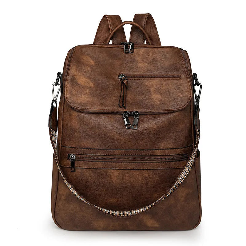 Retro college student backpack with curved shoulder straps in six colour options including black, blue and brown variations