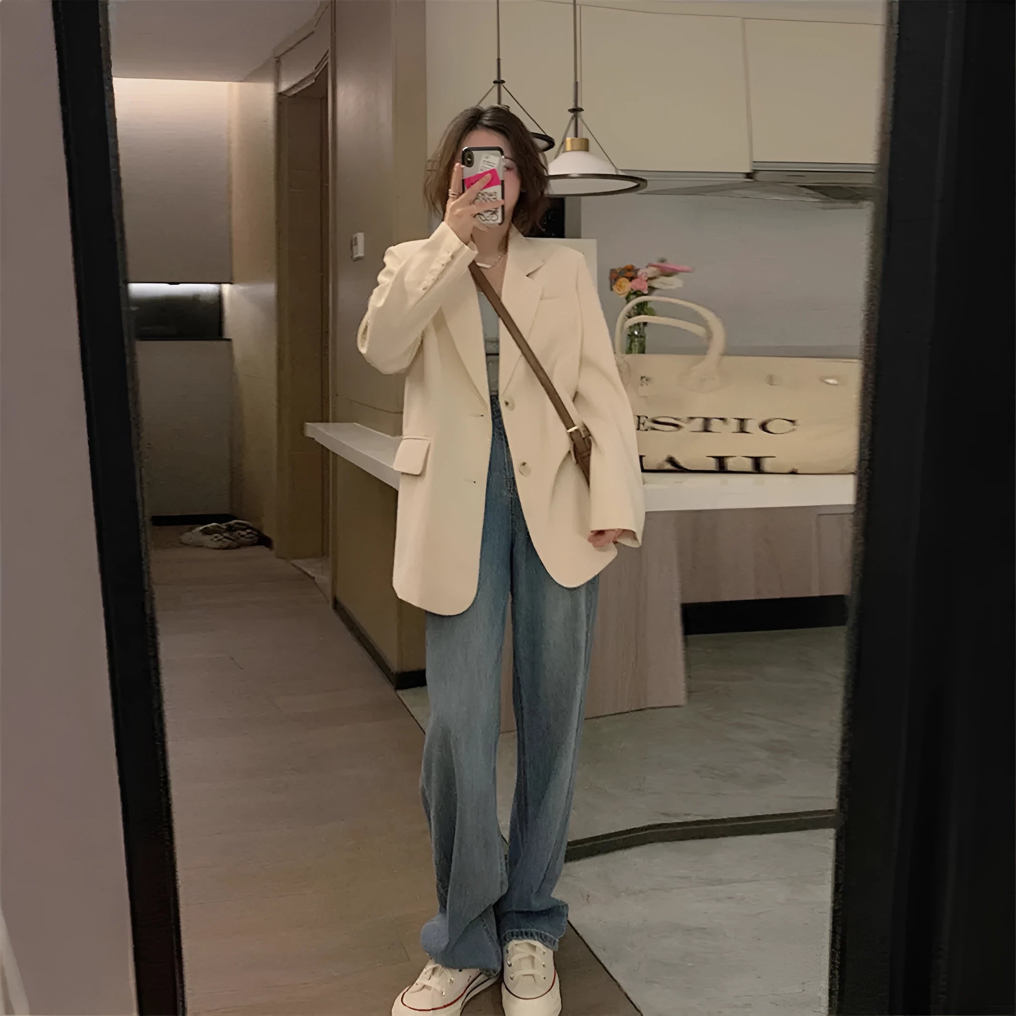 Korean style solid colour polyester commute jacket with long sleeves and pockets on a hanger.