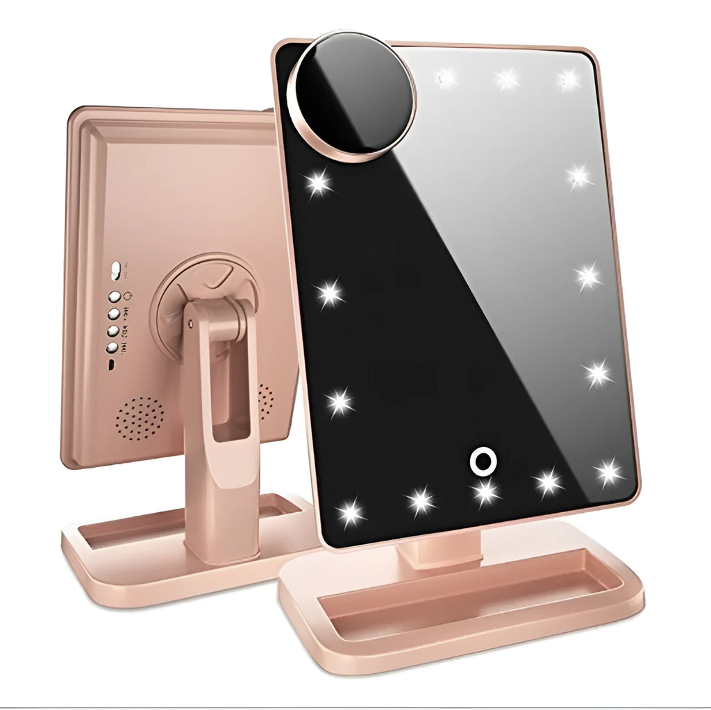 Pink and white LED makeup mirror with a ring of lights, a 10X magnifying panel, and a Bluetooth speaker on a dressing table.