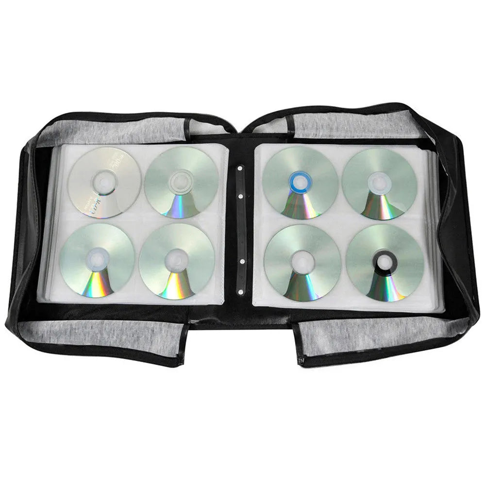 Black oxford fabric CD DVD storage wallet with hand strap and zipper, showing interior disc slots.