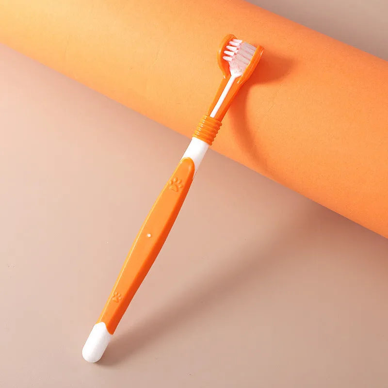 Pet toothbrush in assorted colours including orange, green, yellow, blue pink, and black and yellow.