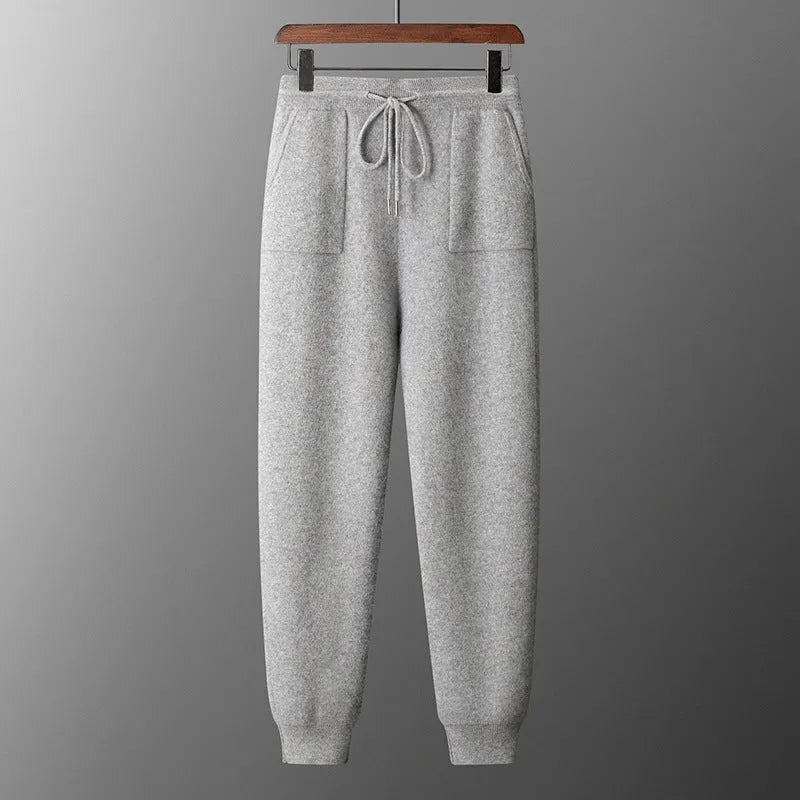 Men's light grey cashmere hoodie and matching trousers casual set laid flat.