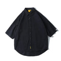 Man wearing a loose-fit cotton cardigan shirt in a solid colour, showcasing the Japanese-inspired summer style.