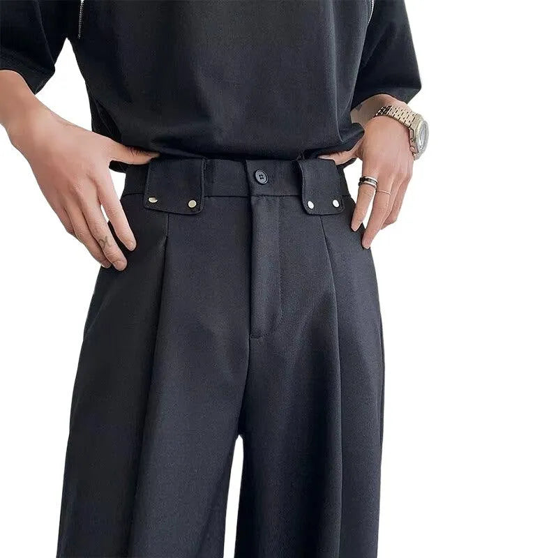 Women's black high-waisted cropped suit pants with draping effect, sizes M-3XL, on display