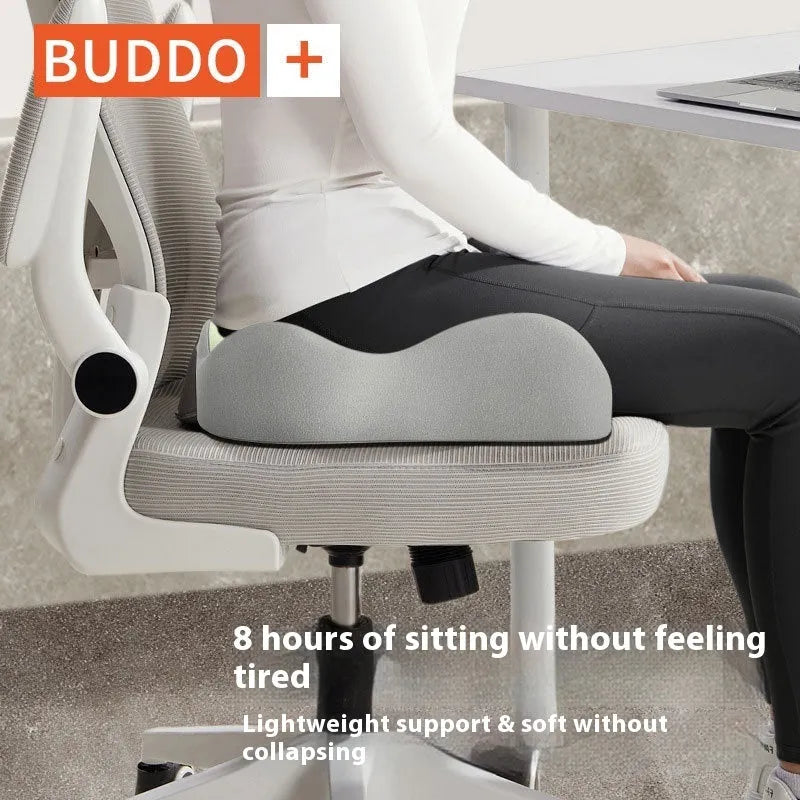 A grey and blue memory foam seat cushion for waist and tailbone support on an office chair.