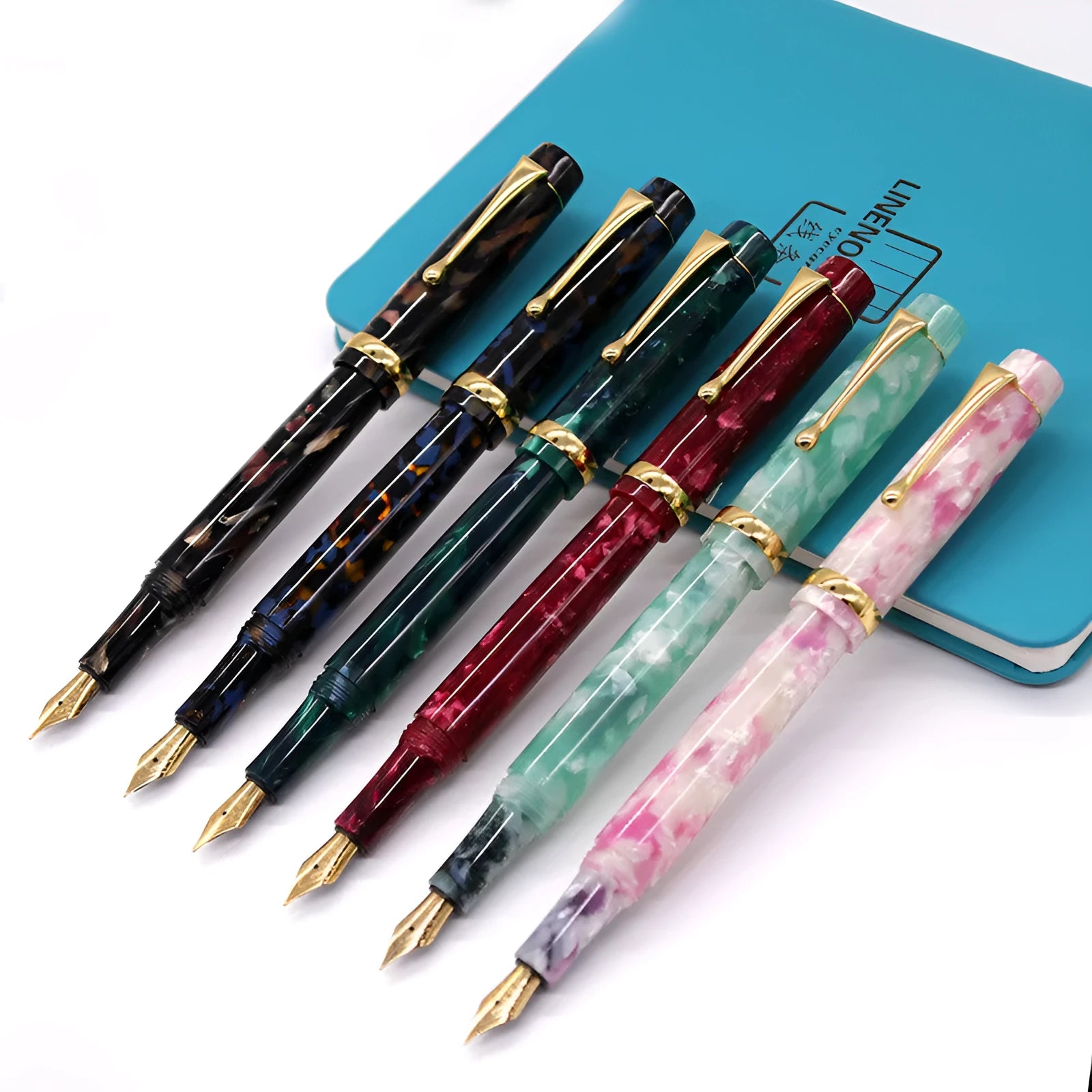 Acrylic fountain pen with smooth writing tip, available in multiple colour options including black, blue, green, light green, pink, and red.