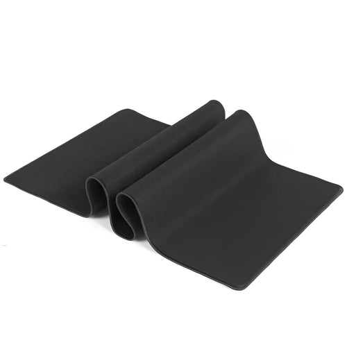 All black extra long desk pad with overlock stitching on a wooden desk with keyboard and mouse
